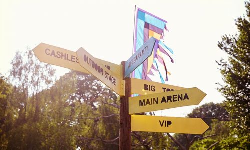 close-up-of-signpost-at-outdoor-music-festival-PX348SH.jpg